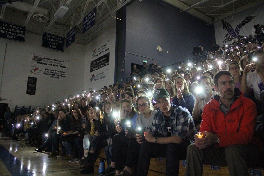 Hundreds of local students and parents light up their phones at a May 8 vigil at Highlands Ranch High School for STEM School shooting victims and survivors.